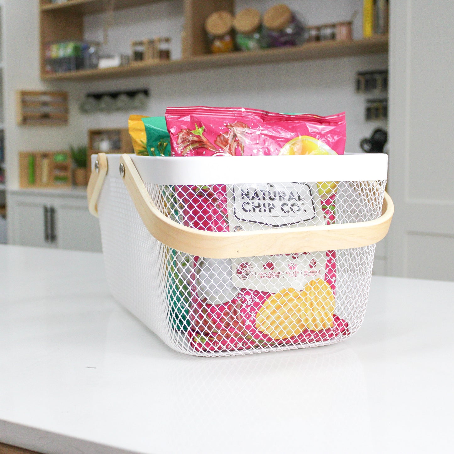 mesh metal basket with bamboo handle for home organisation, use in the kitchen, bathroom, laundry and more.