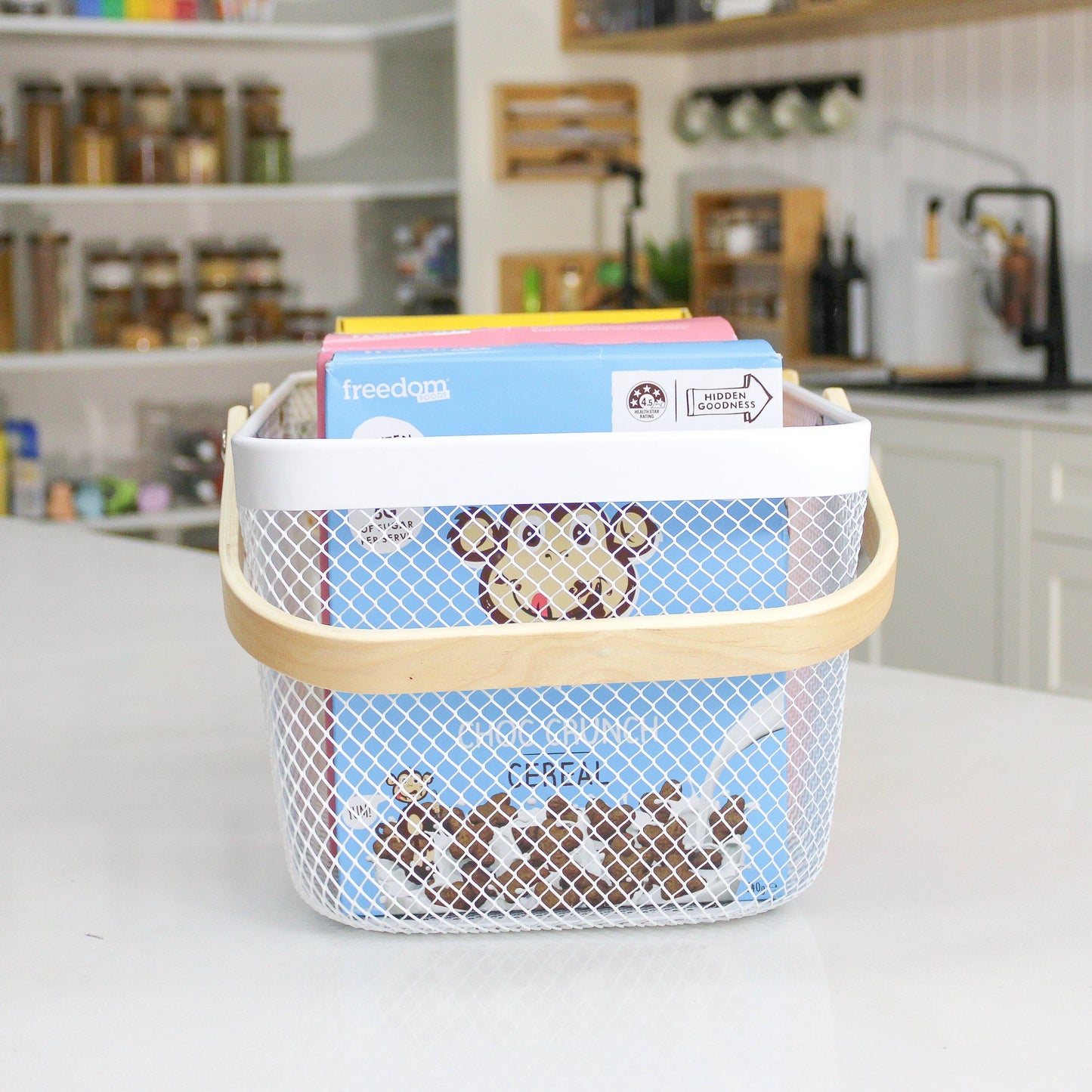 mesh metal basket with bamboo handle for home organisation, use in the kitchen, bathroom, laundry and more.
