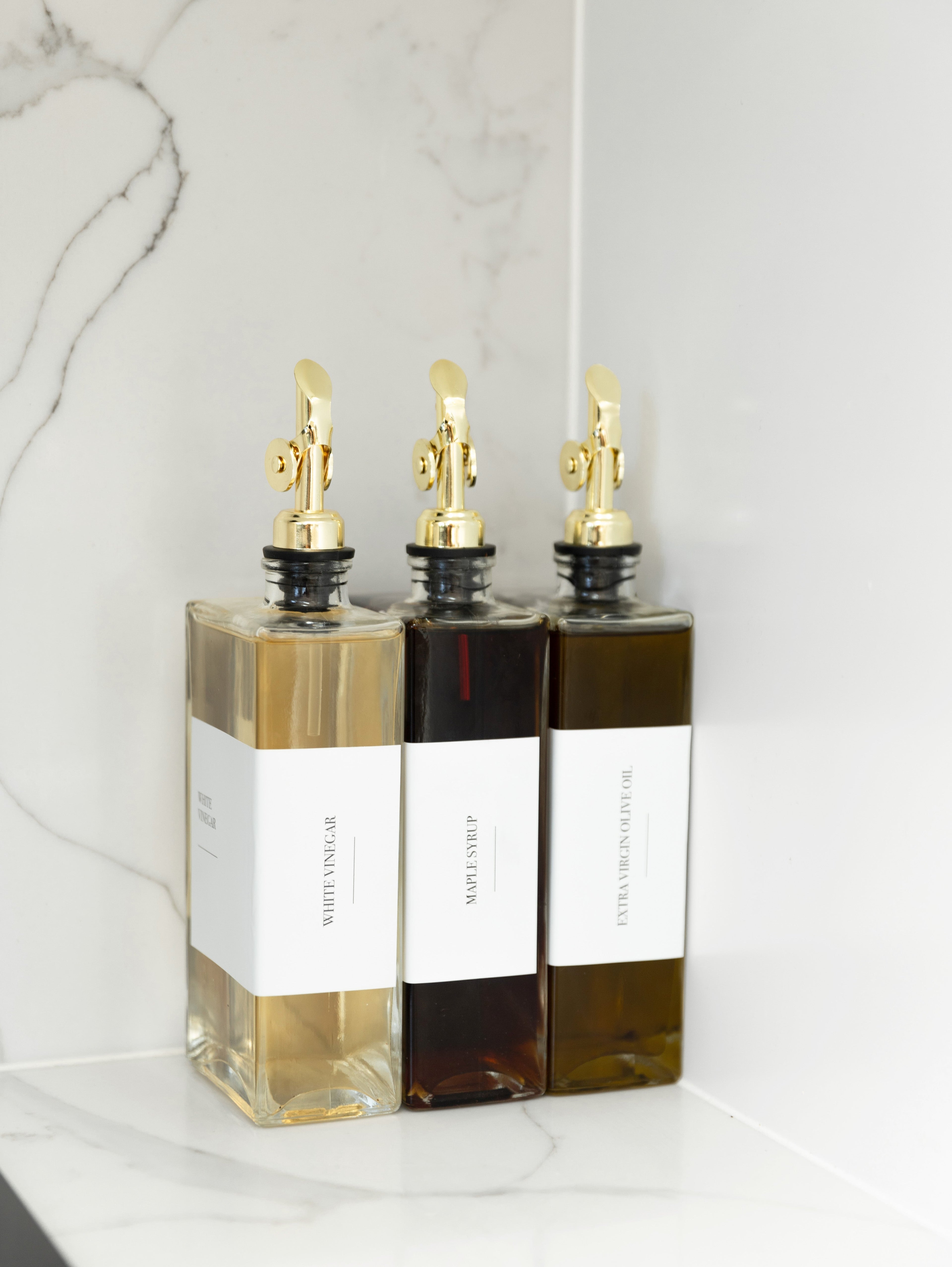 Oil and vinegar book bottle. sleek and elegant oil bottles. Refillable glass bottles.